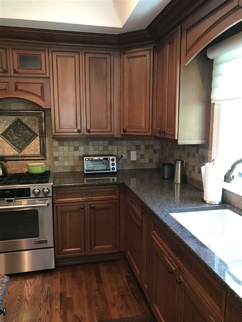 stainless steel fridge brown cabinet|kitchens with brown cabinets.